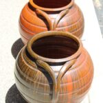 Pair of Handled Orange, Charcoal Stoneware Planters