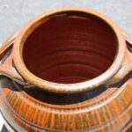 Pair of Handled Orange, Charcoal Stoneware Planters